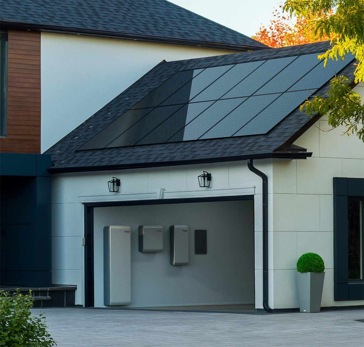 Generac PWRcell 2 mounted in garage with solar panels on the roof