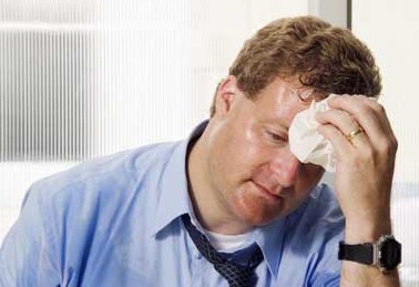 man during peak energy use sweating
